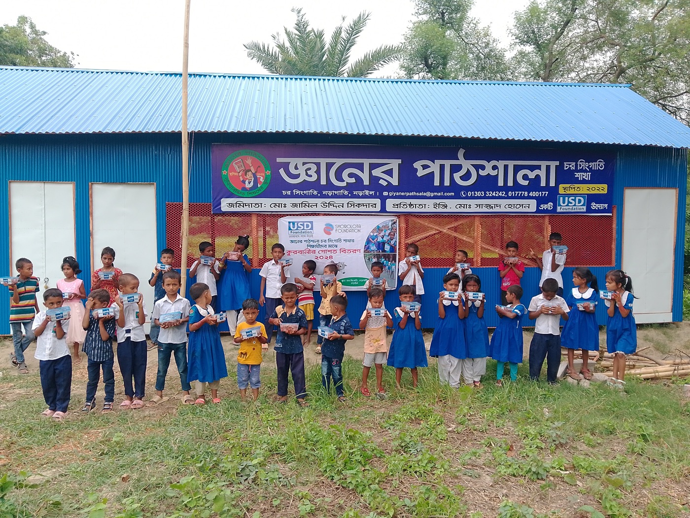Children gathered outside a community school programme